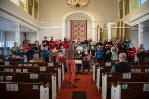 First Parish Adult and Youth Choirs perform during a Sunday service.